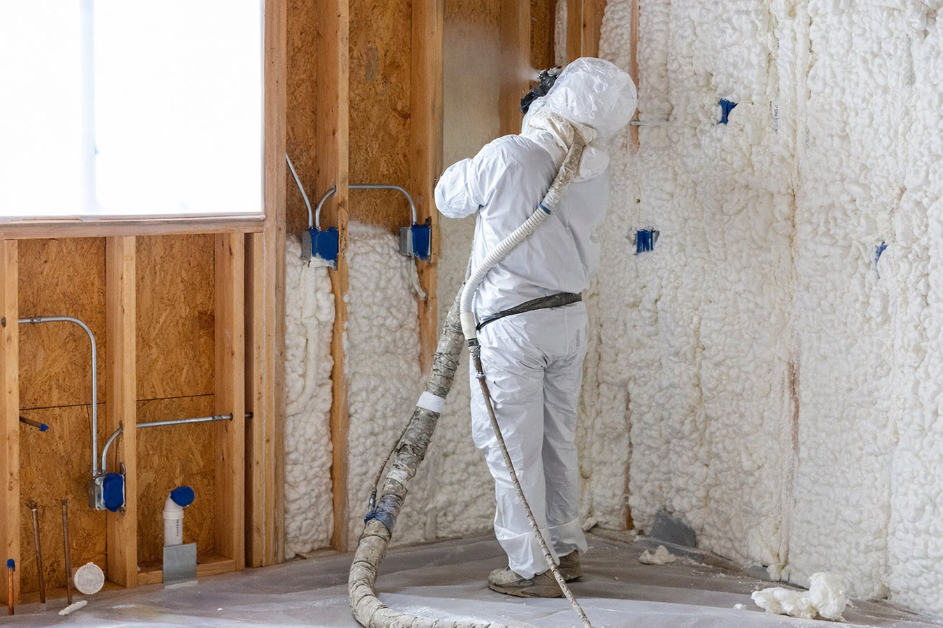 Insulation contractor working in an Erie, PA home